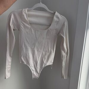 Long Sleeve Scoop Neck Bodysuit in Light Cream skims